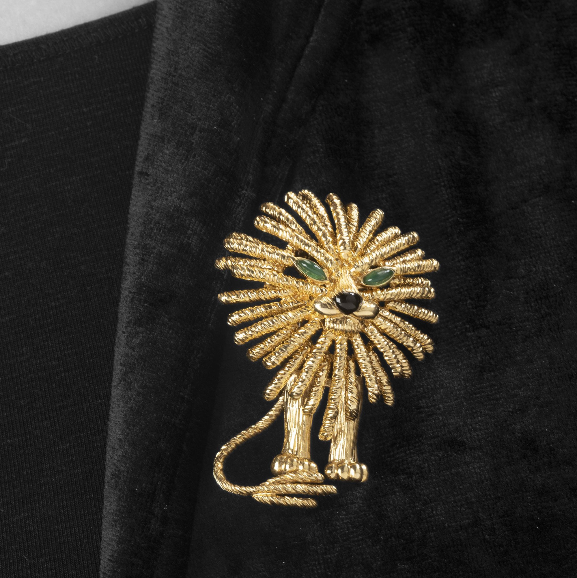 An eighteen-carat yellow gold brooch depicting a lion. Signed Van Cleef & Arpels, made in Paris, dated 1972 and numbered. In original case.