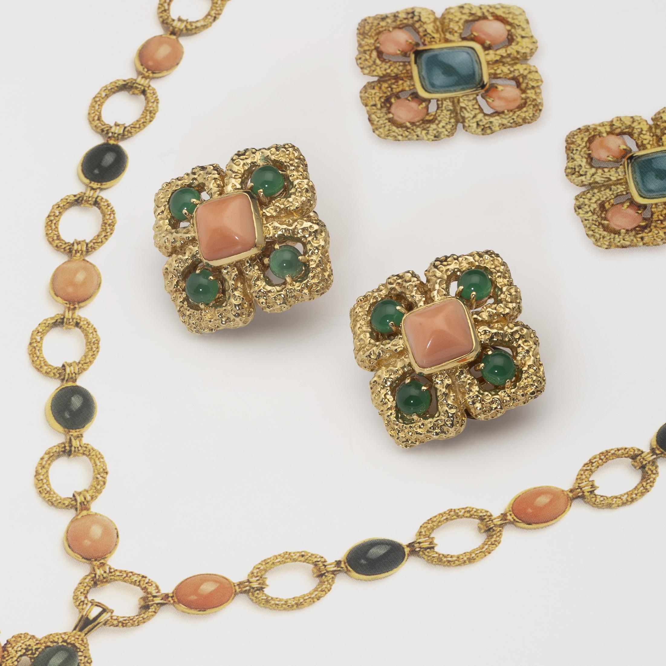 A pair of eighteen carat yellow gold clip earrings, model ‘Delphes’, set with coral and green agate. Signed Van Cleef & Arpels, made in Paris, ca 1970.
