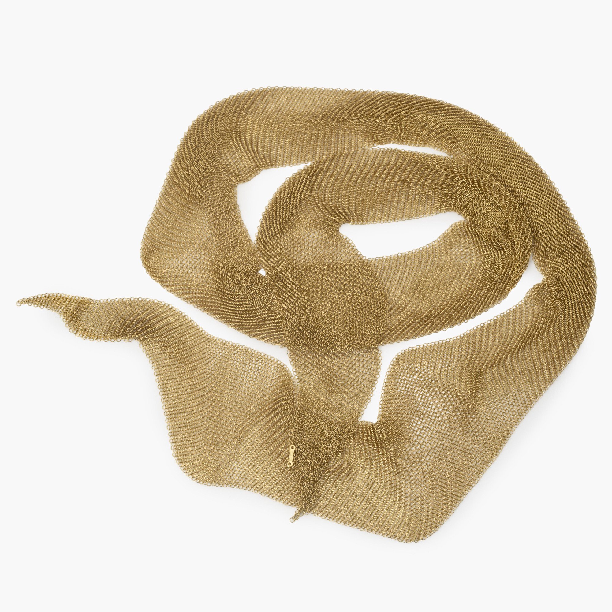 An eighteen carat yellow gold necklace designed as a scarf, signed Elsa Peretti for Tiffany & Co., made in the USA, ca 1980. With original pouch.