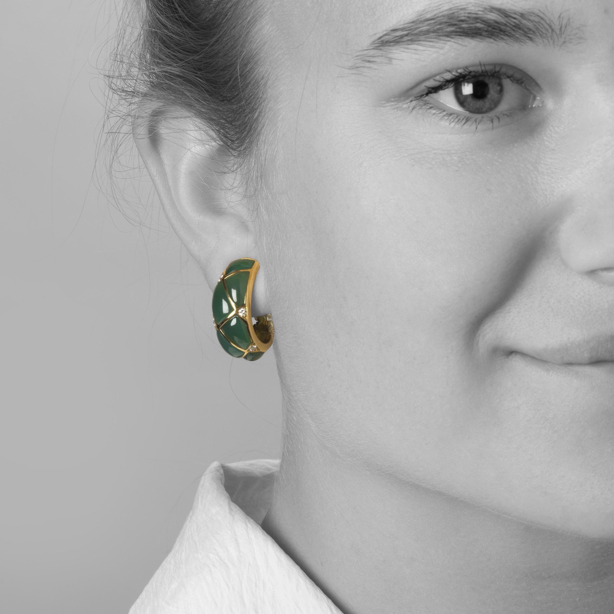 A pair of eighteen carat yellow gold clip earrings, set with green agates and diamonds. Signed Van Cleef & Arpels, dated 1967. Made by Pery et Fils, Paris.